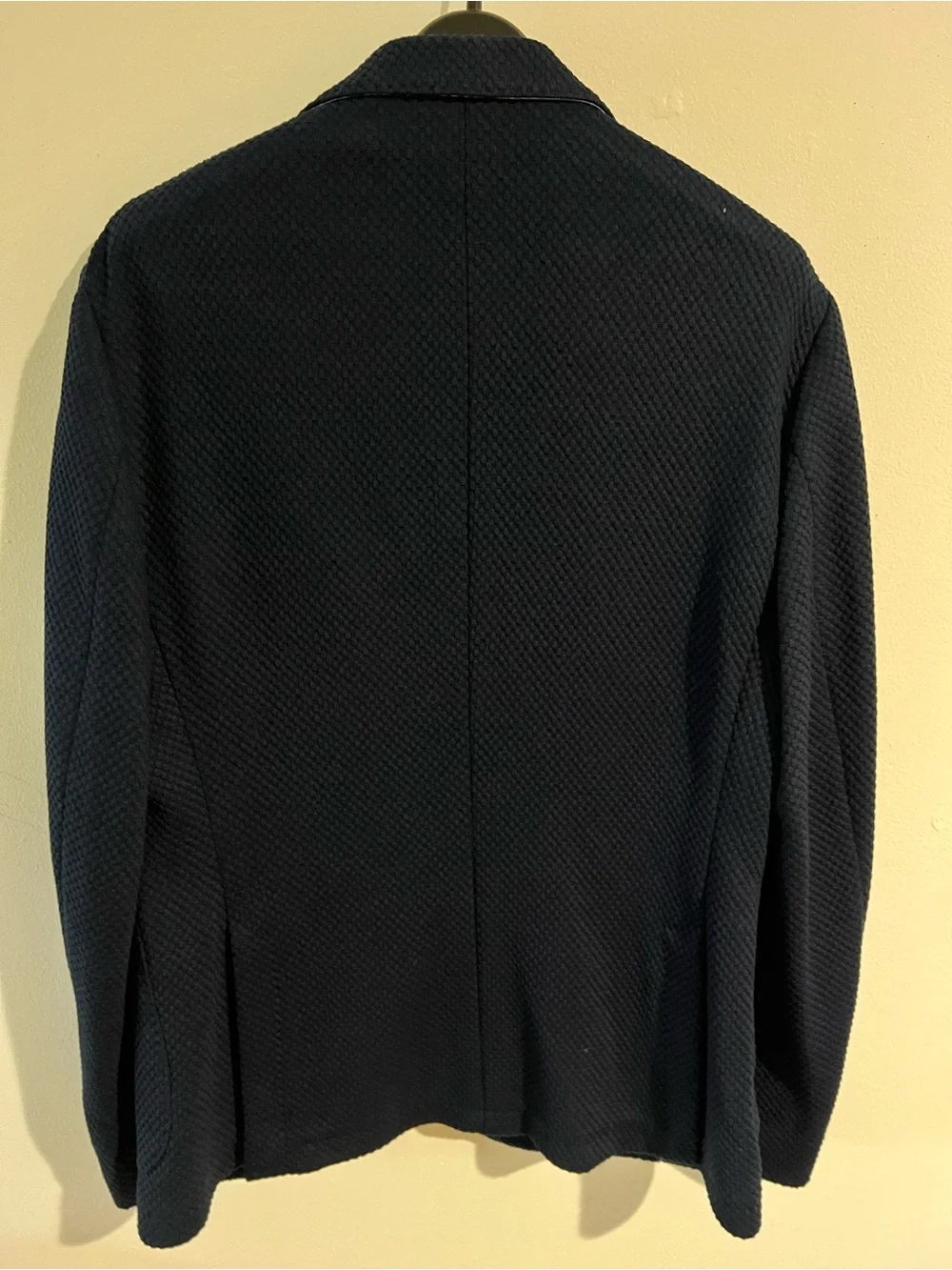 MANGO Man navy blazer features a textured microstructure fabric